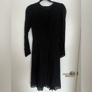 Reformation black long sleeved midi-dress. Excellent condition.